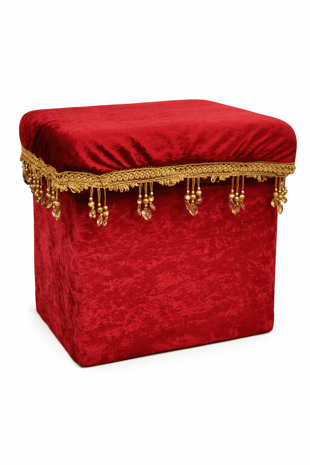 Red velvet decorative ottoman with gold fringe for theatre themed event decor