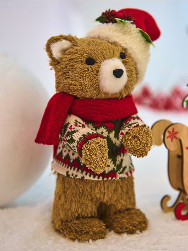 Charming bears dressed in traditional red and green tartan plaid skirts and trousers, paired with chunky knit sweaters and winter scarves.